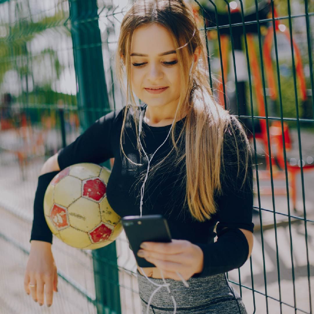 Woman holding soccer ball